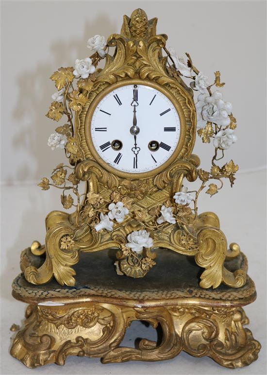 A 19th century French ormolu mantel clock, 8.5in., with additional giltwood plinth